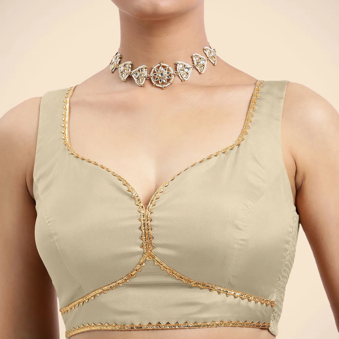 Ishika x Tyohaar | Cream Sleeveless FlexiFit™ Saree Blouse with Beetle Leaf Neckline with Golden Gota Lace and Back Cut-out with Tie-Up